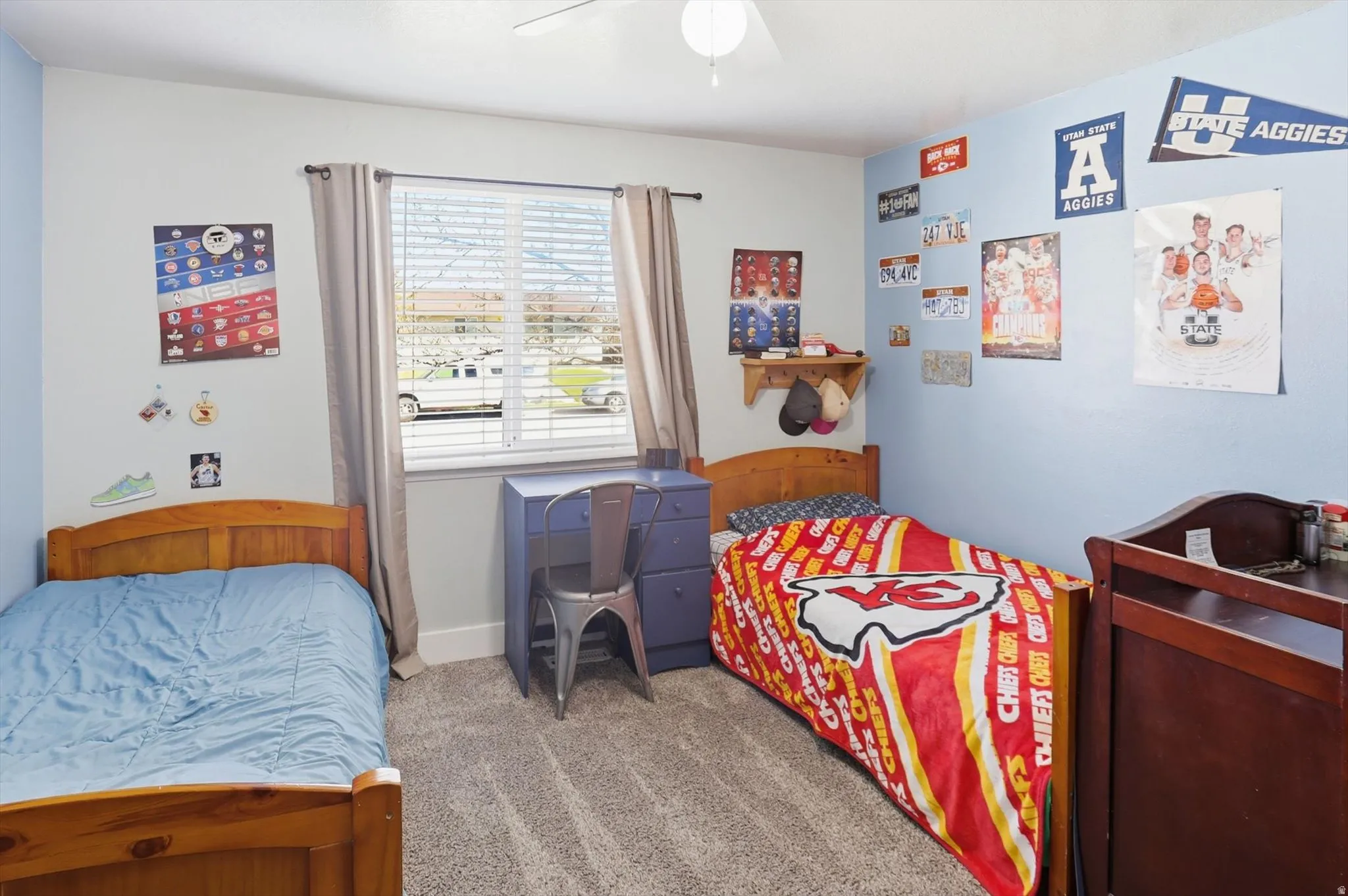 Bedroom with carpet flooring and a ceiling fan