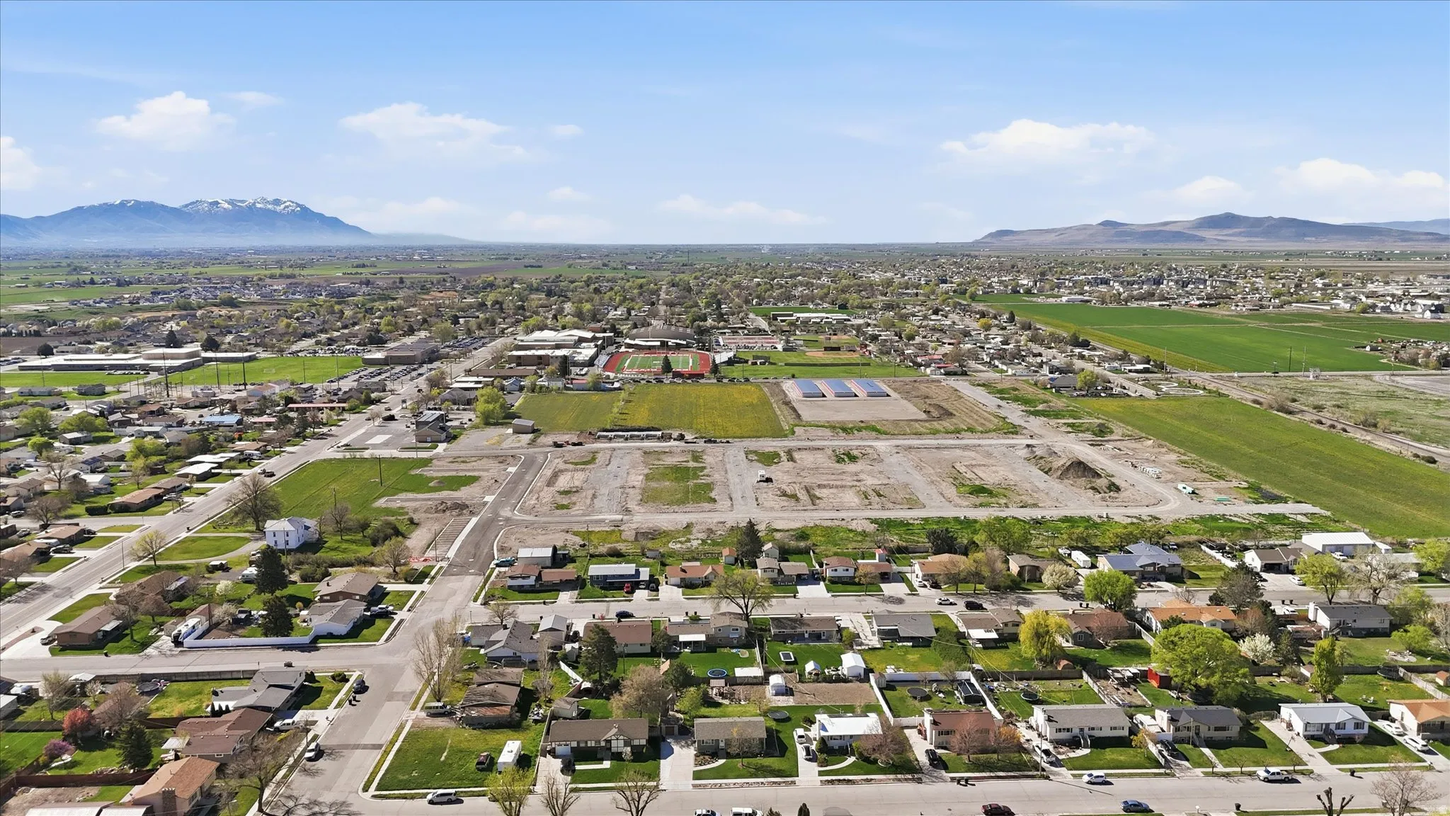 Aerial view of residential area featuring mountains