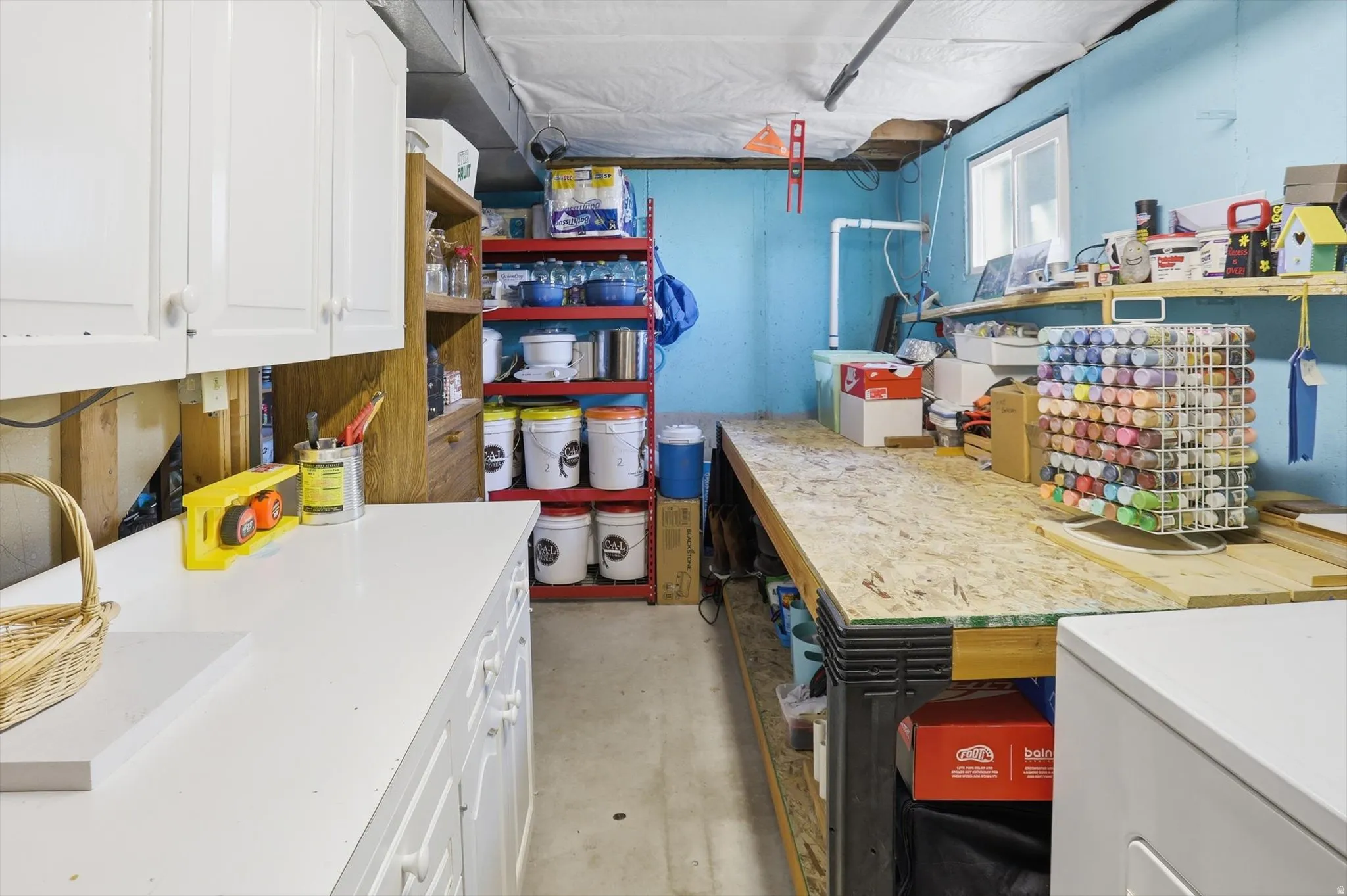 Storage area featuring washer / clothes dryer