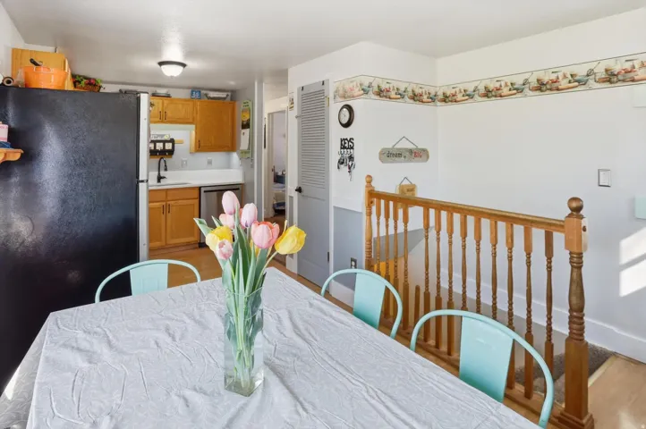 Dining room with light wood-type flooring and baseboards