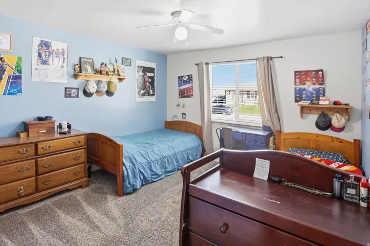 Bedroom with carpet floors and ceiling fan
