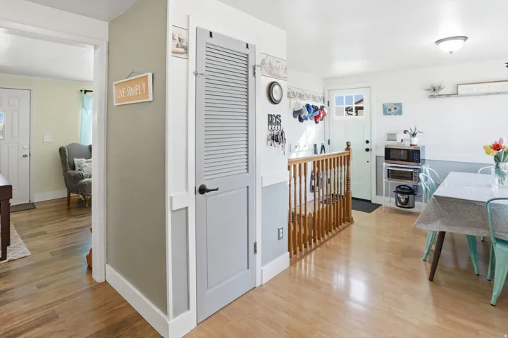 Corridor with light wood-style flooring
