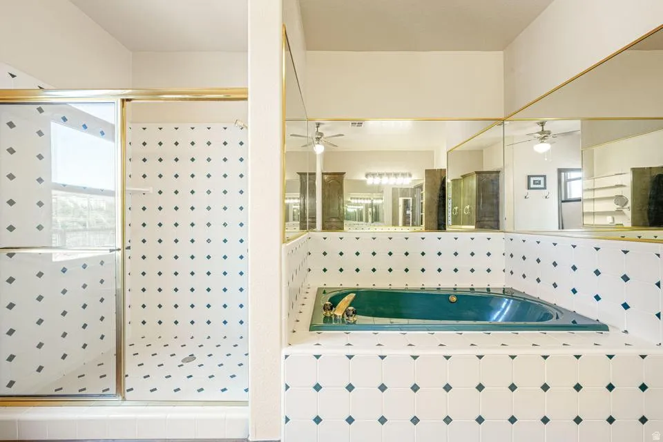 Full bath with a garden tub and a shower stall