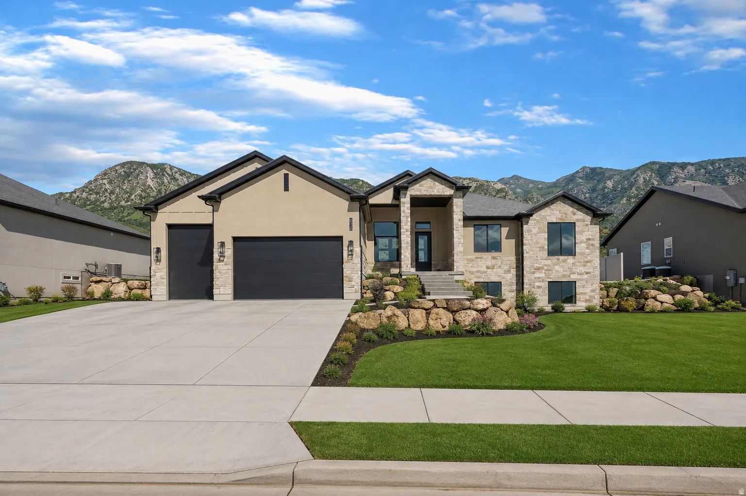 Contemporary exterior featuring stone and stucco finishes