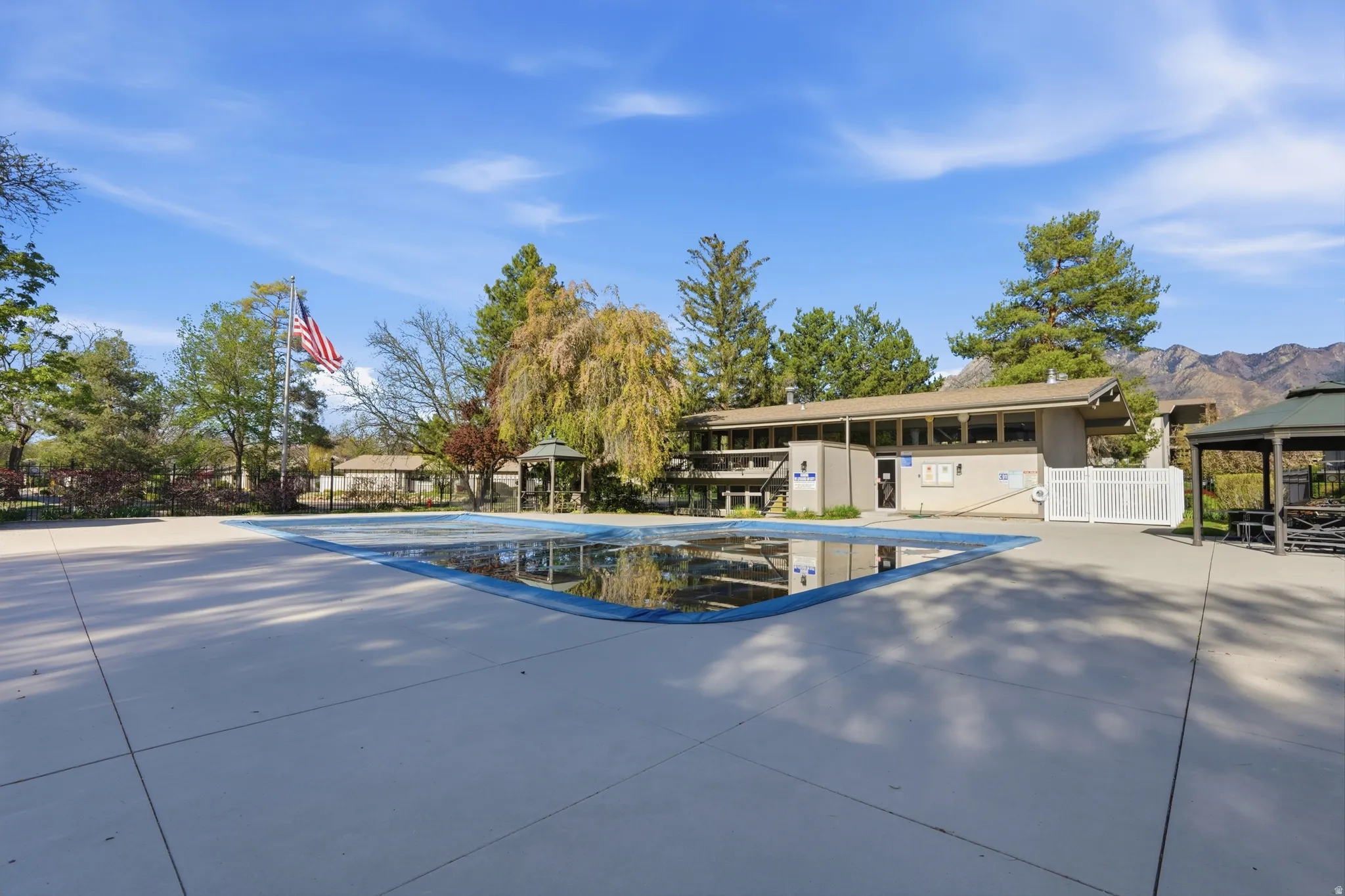 Community pool featuring a gazebo and a mountain view