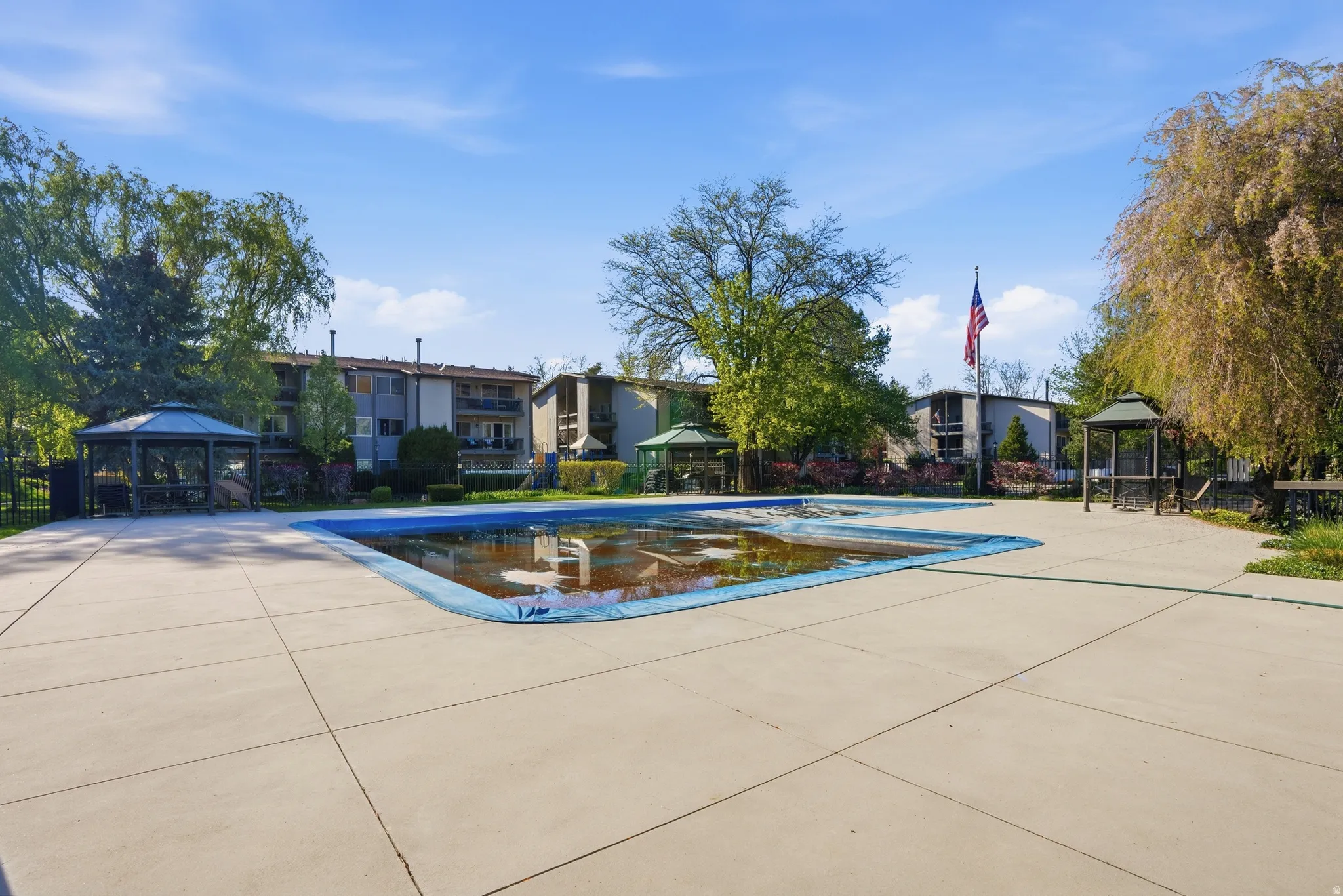 Community pool featuring a gazebo and a patio area