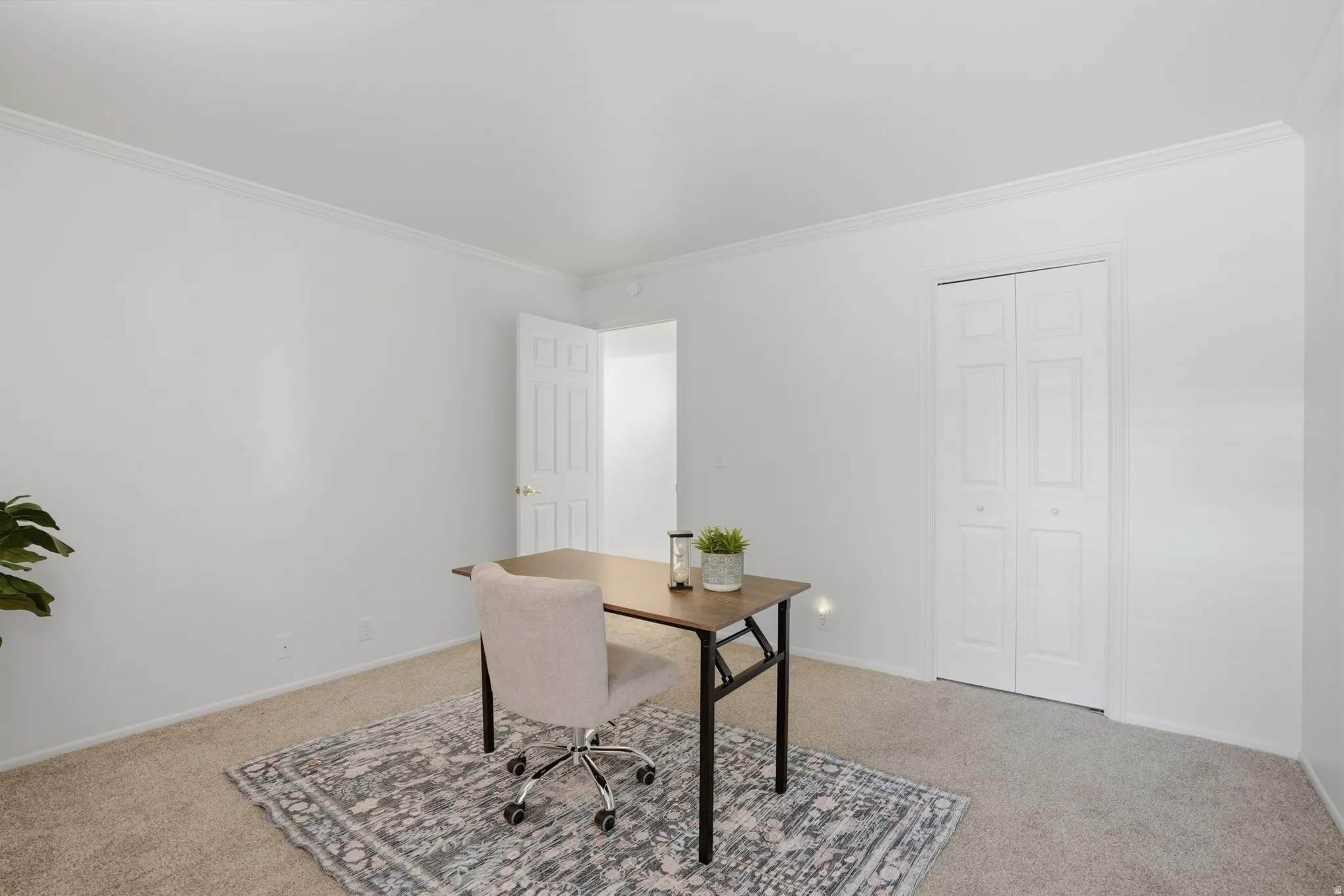 Office featuring crown molding and light colored carpet