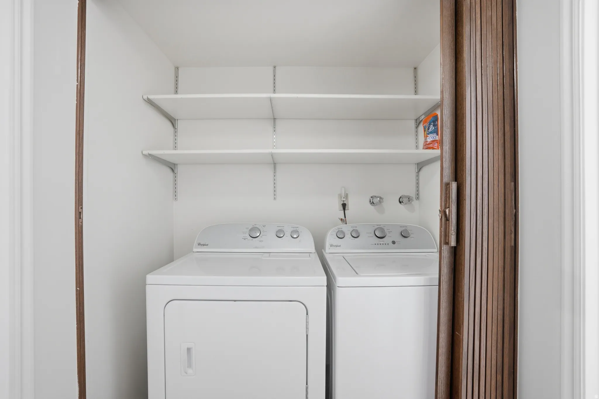 Laundry area featuring washing machine and clothes dryer