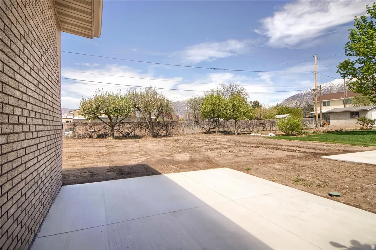 Fenced backyard with a patio area