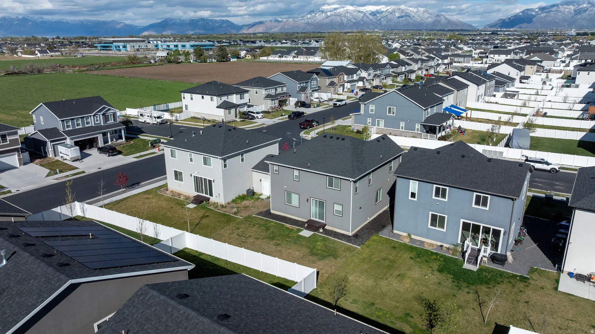Aerial view of residential area featuring a mountain backdrop