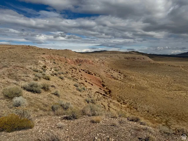 View of mountain backdrop featuring a desert landscape
