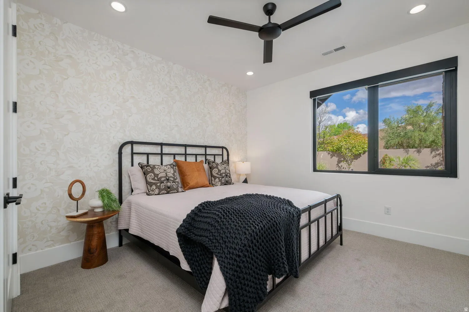 Bedroom featuring light colored carpet, a ceiling fan, recessed lighting, and wallpapered walls
