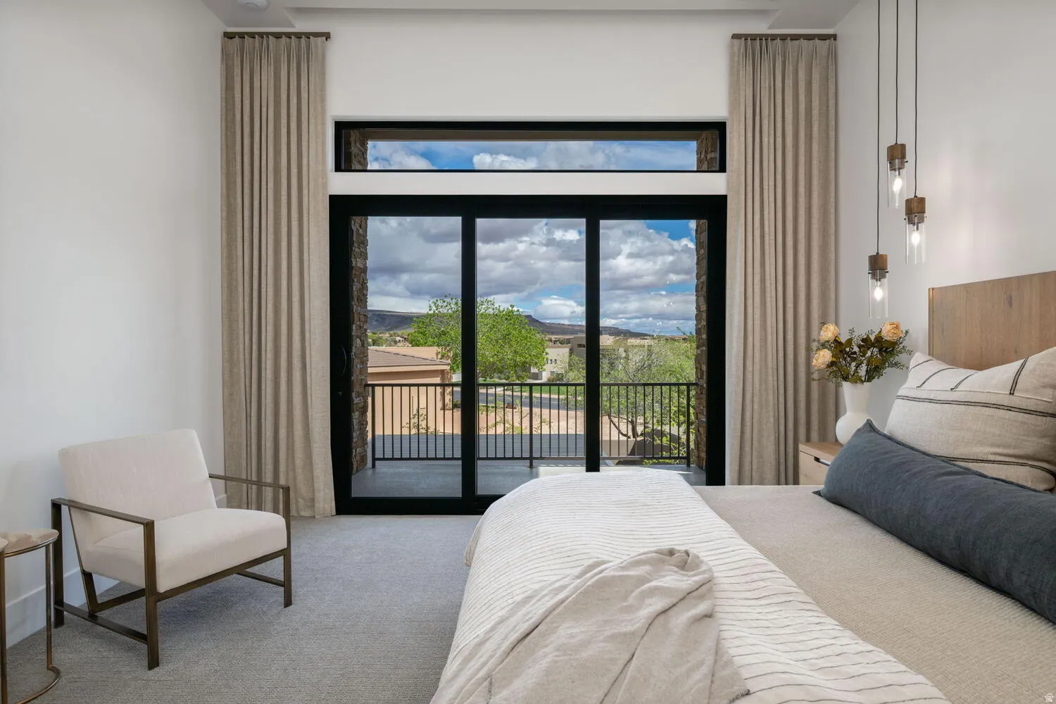 Bedroom with carpet floors and access to outside
