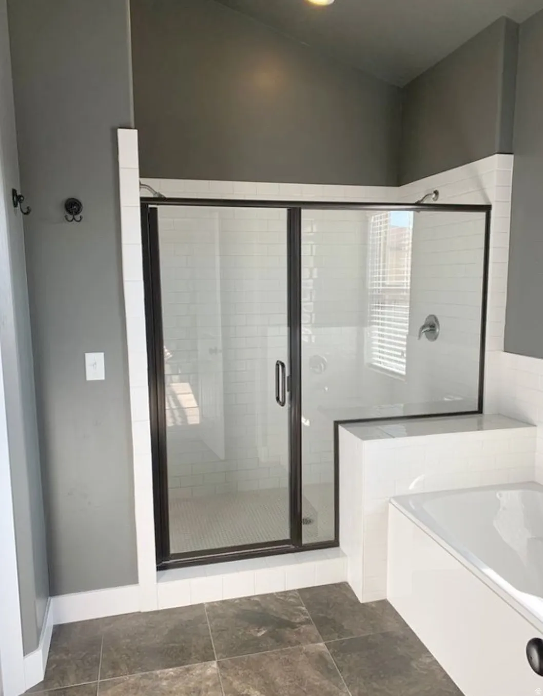 Bathroom with a bath and a stall shower