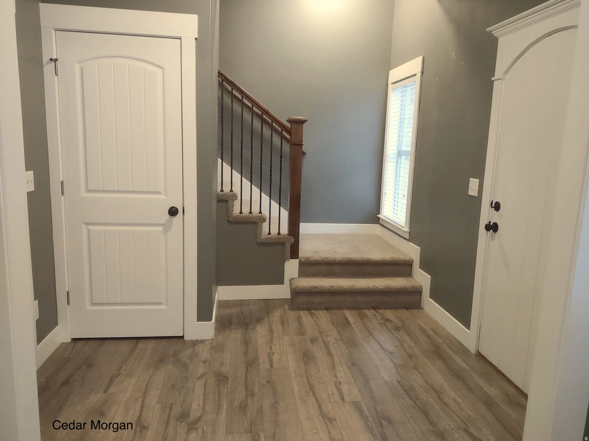 Entrance foyer with stairway and light wood-type flooring