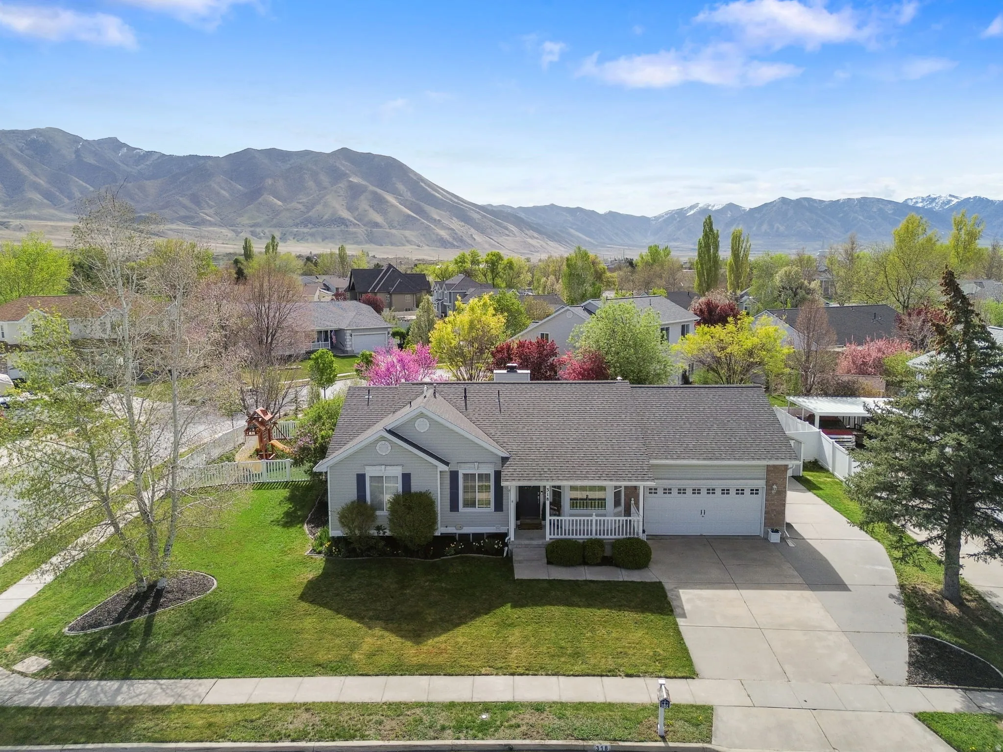 Aerial perspective of suburban area with a mountain backdrop