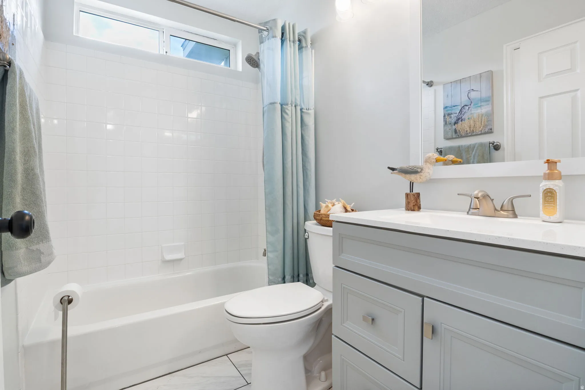 Full bathroom featuring vanity and shower / bath combo