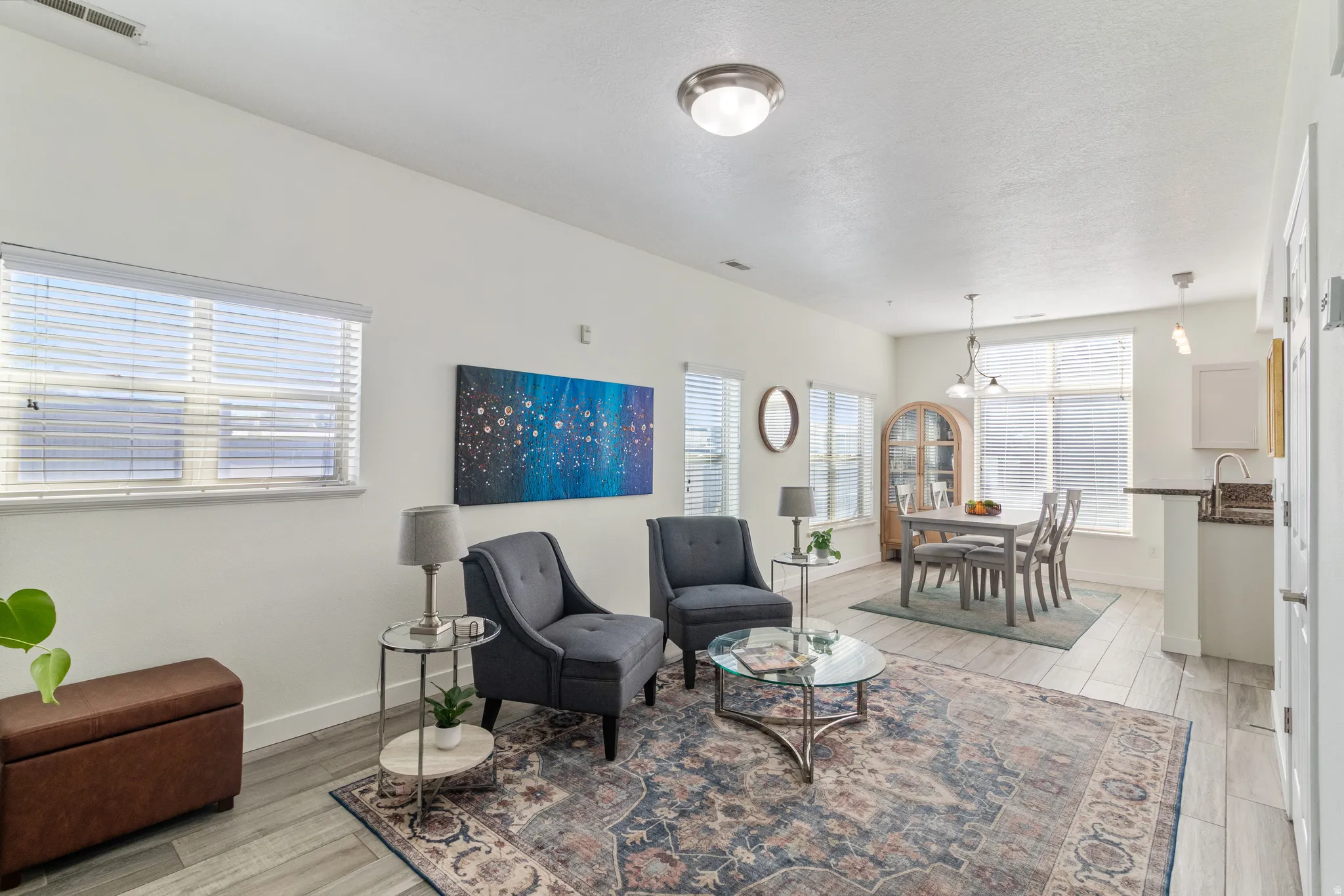 Living area featuring light LVP flooring and healthy amount of natural light