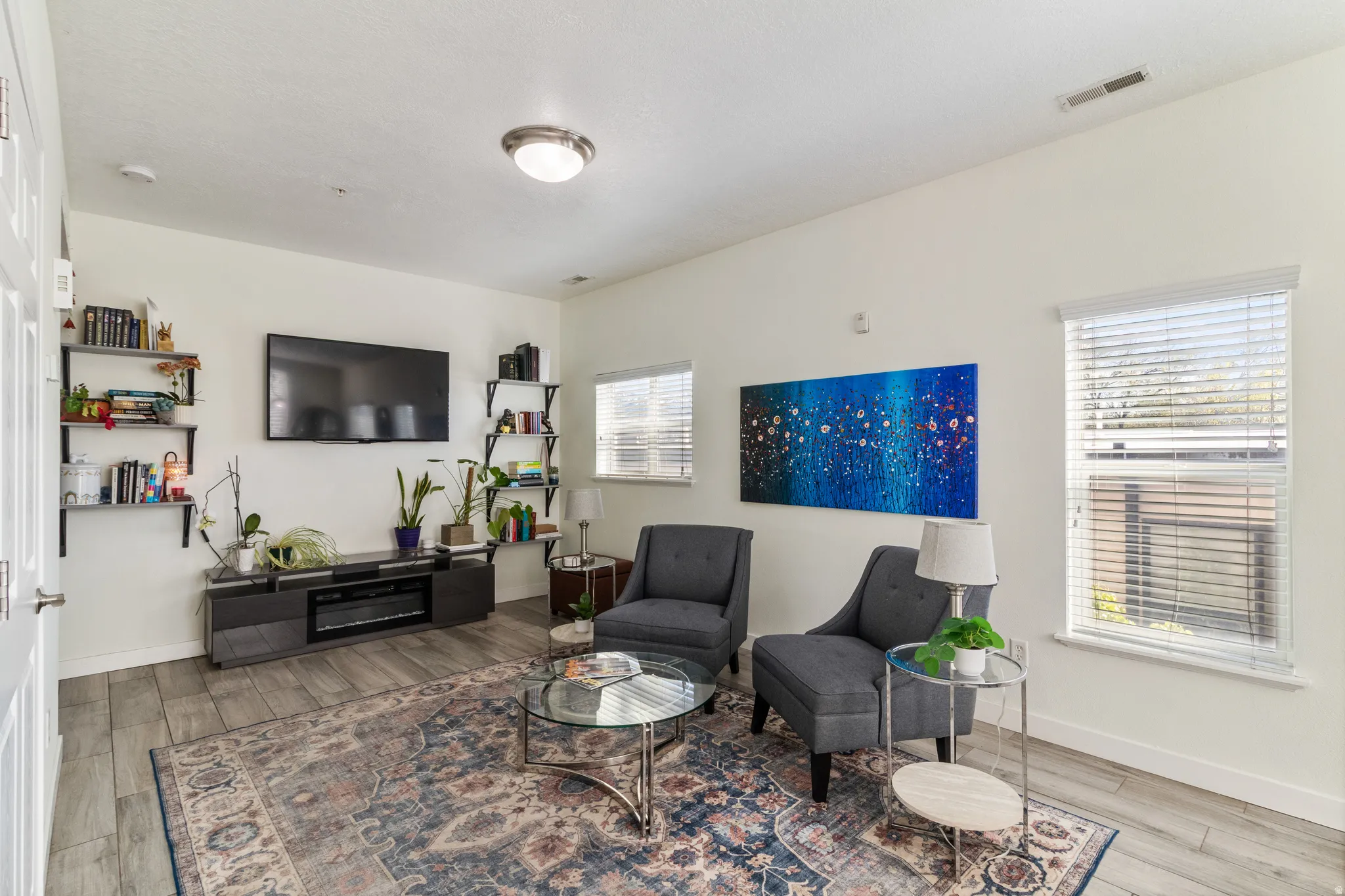 Living room featuring LVP floors and baseboards