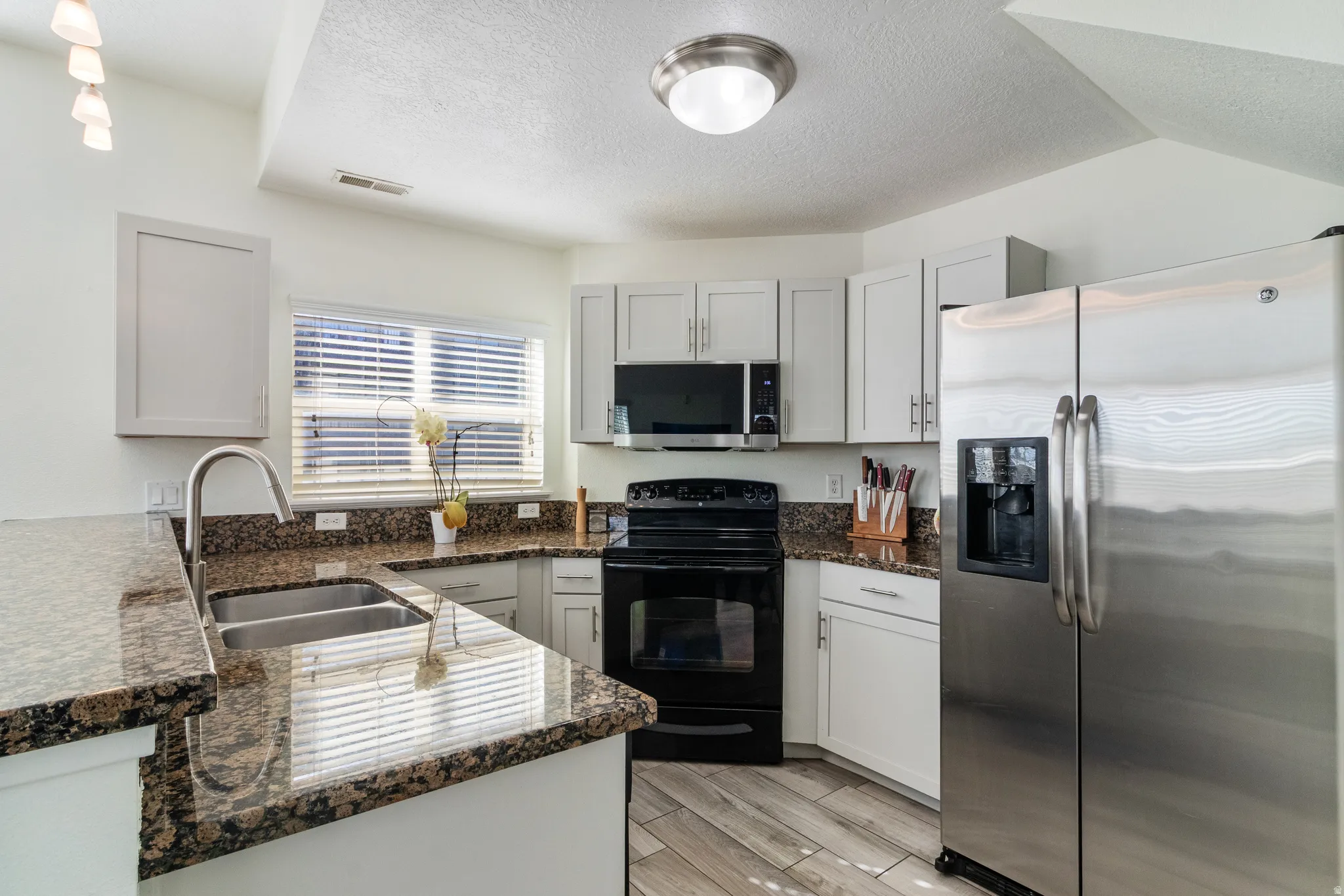 Kitchen featuring stainless steel appliances and granite countertops.