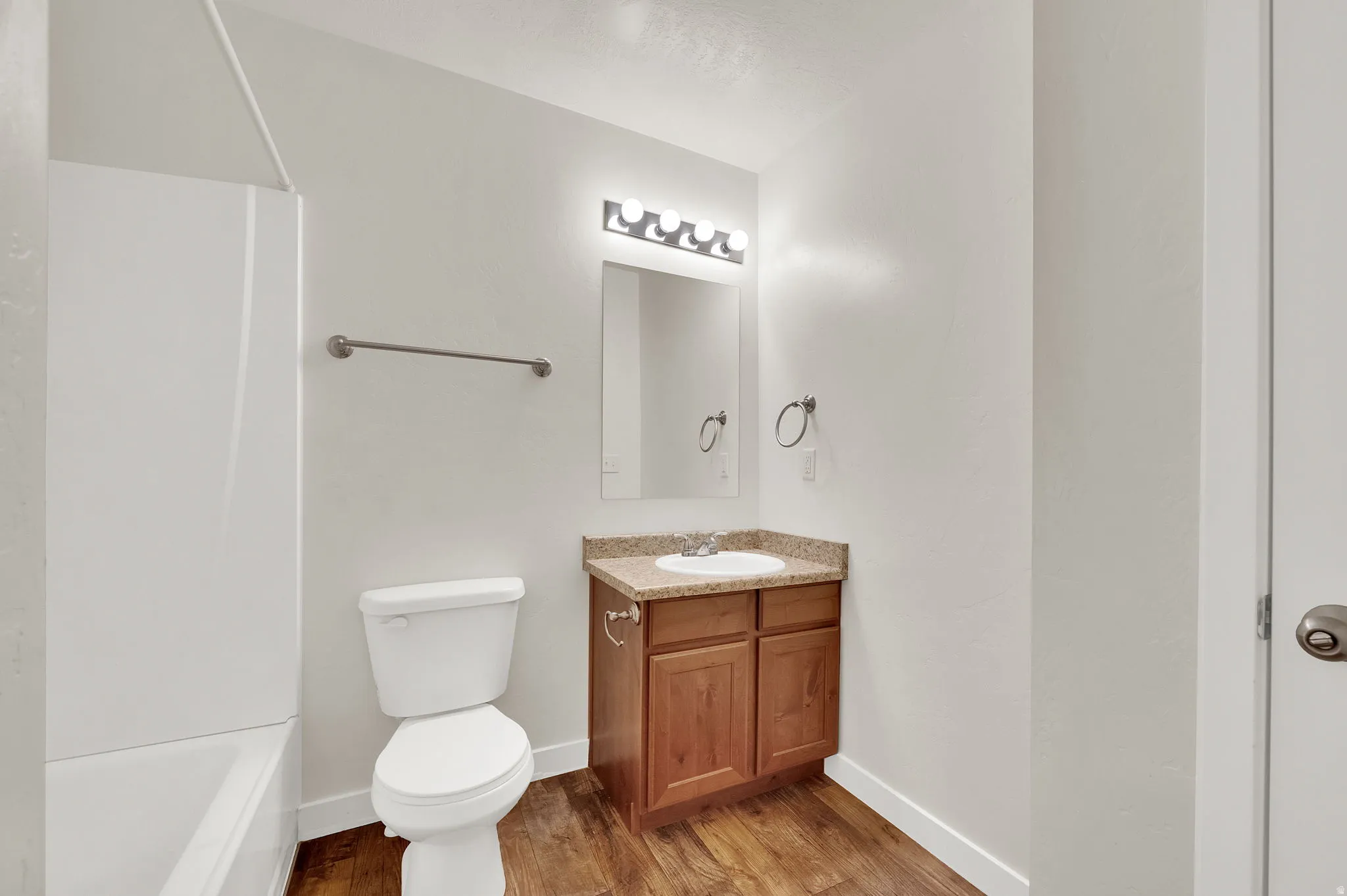 Full bathroom featuring vanity and light wood finished floors