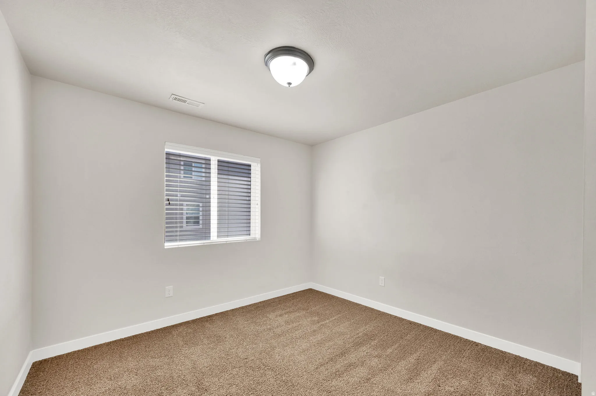 Empty room with baseboards and carpet floors