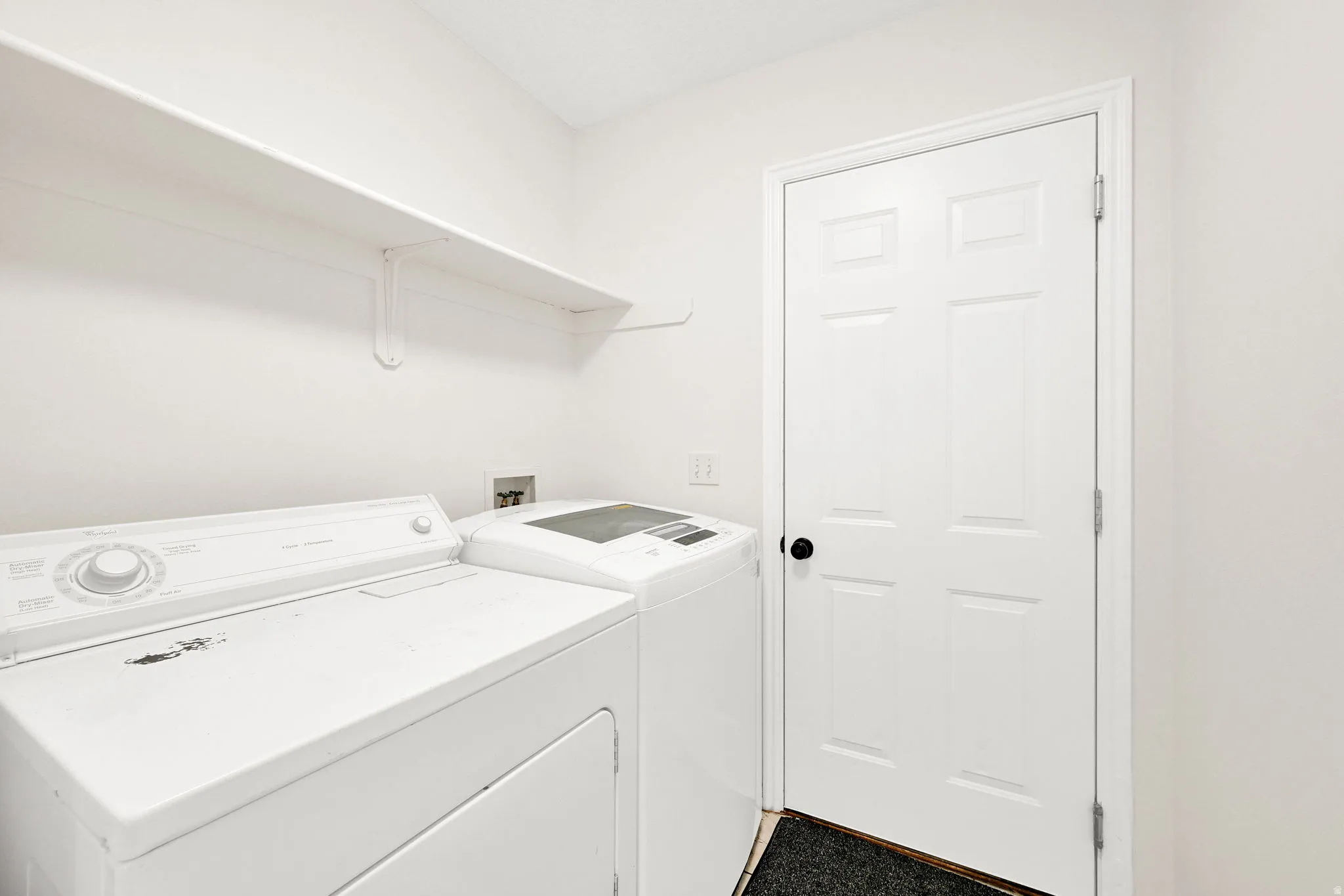 Laundry area featuring independent washer and dryer