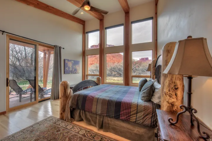 Bedroom with access to exterior, wood finished floors, a ceiling fan, and recessed lighting