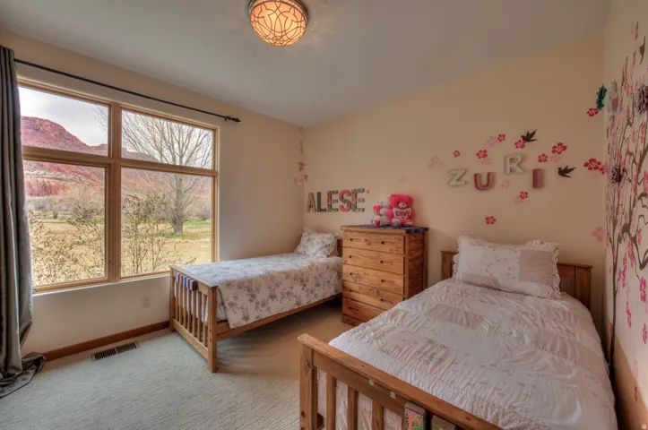 Bedroom with baseboards and carpet flooring