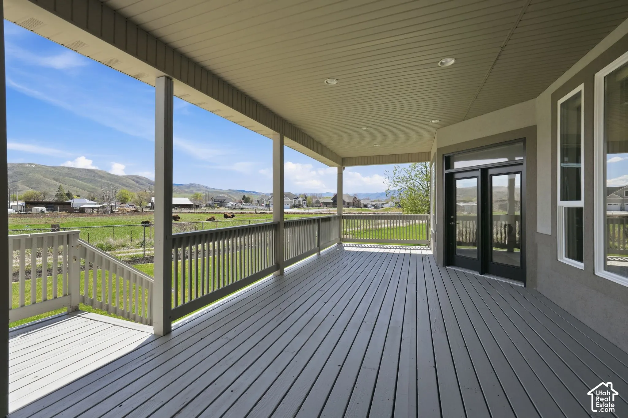 Wooden porch with a mountain view and a residential view