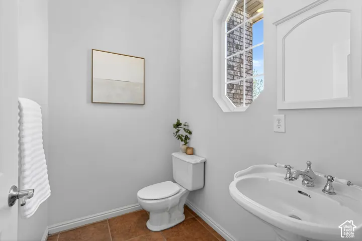 Bathroom featuring baseboards and tile patterned floors