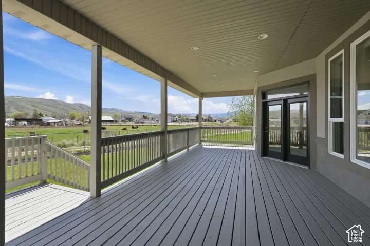 Wooden porch with a mountain view and a residential view