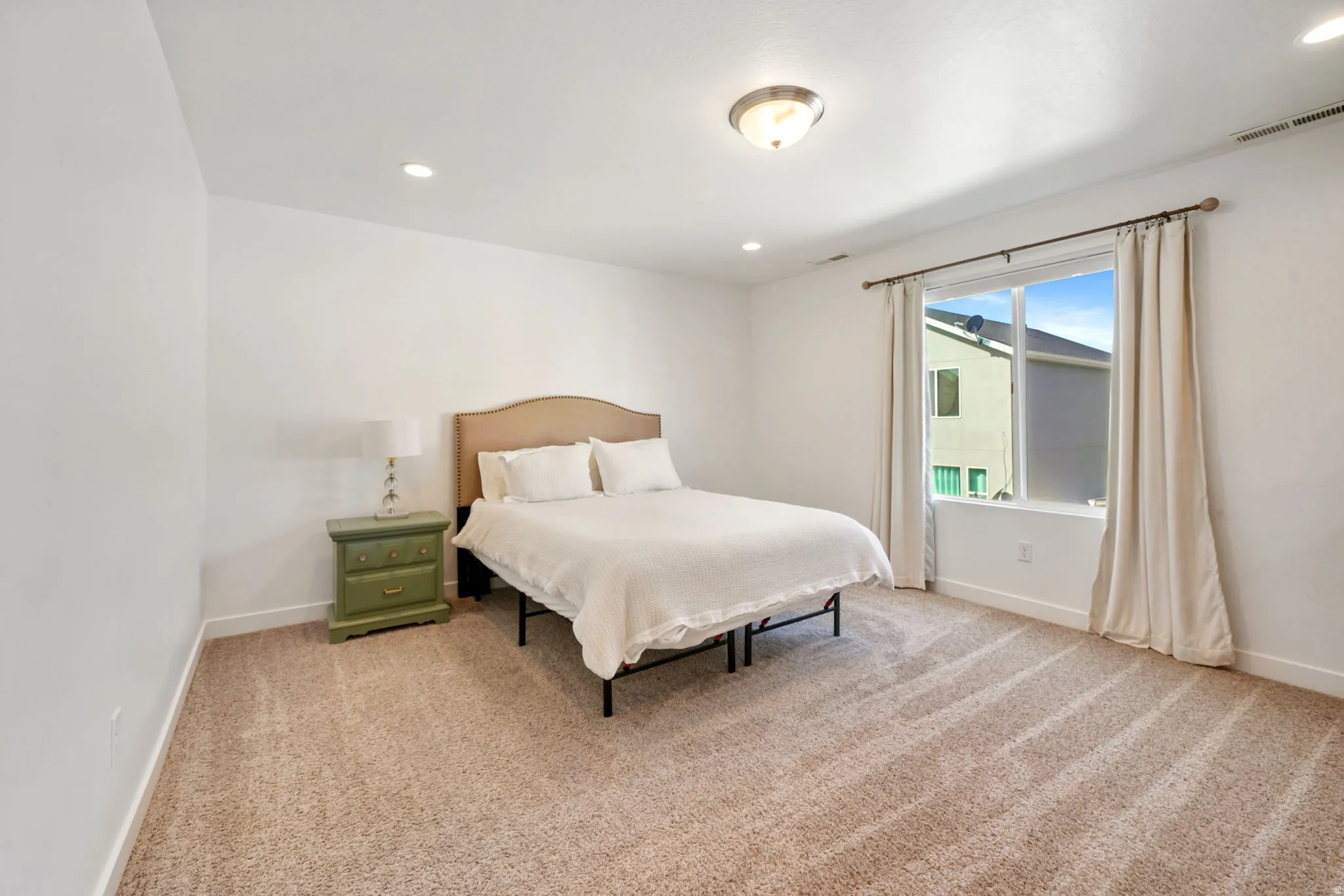 Bedroom featuring recessed lighting and light colored carpet
