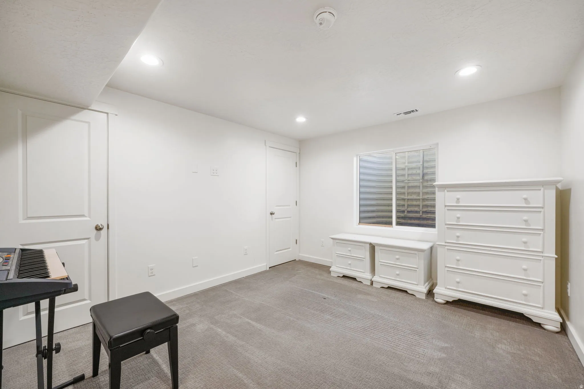 Unfurnished office with light colored carpet and recessed lighting