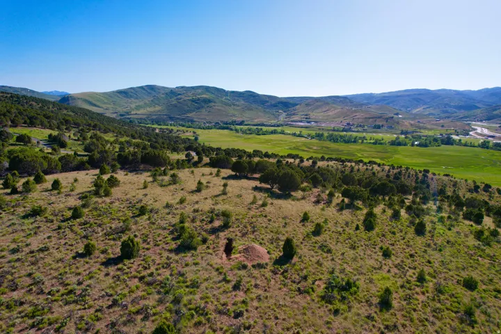 View of mountain backdrop featuring rural landscape