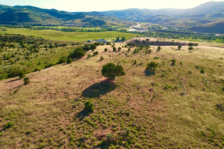 Aerial view of sparsely populated area featuring a mountainous background