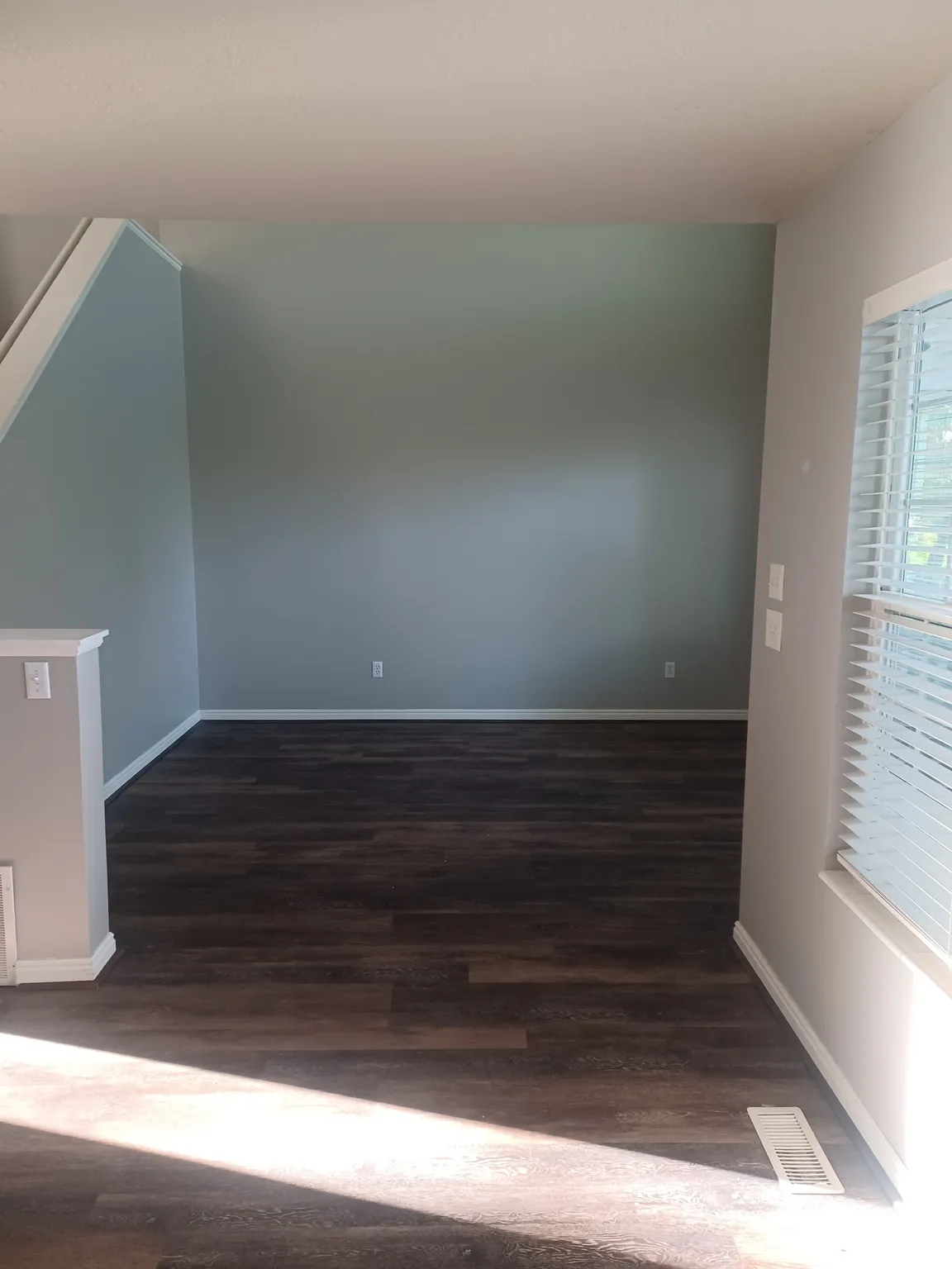 Family Room with dark wood-style floors and baseboards
