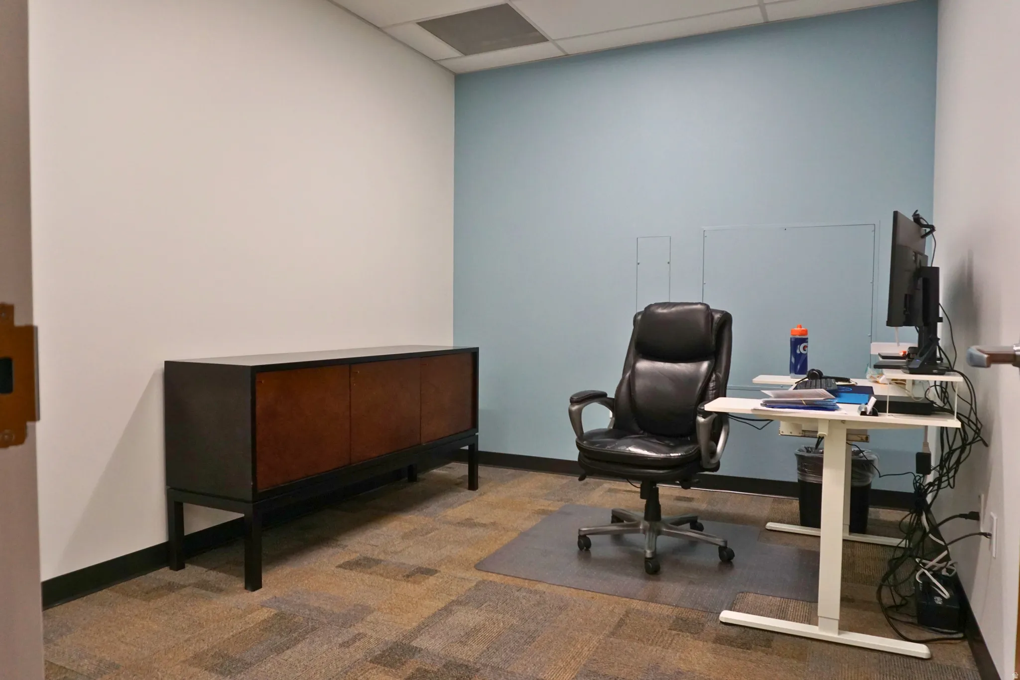 Office featuring a paneled ceiling