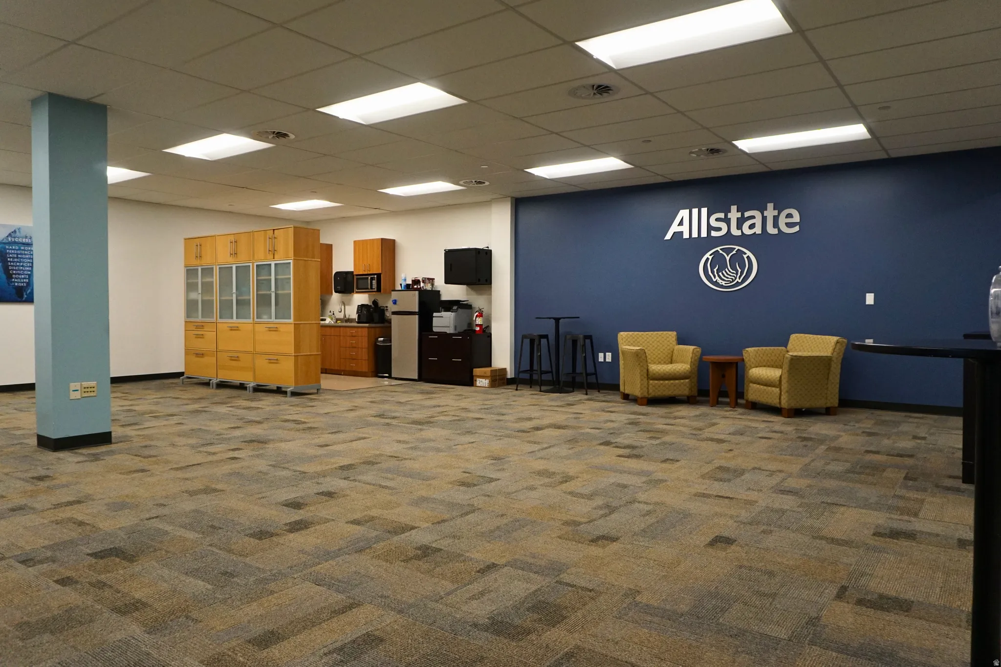 Office with a paneled ceiling
