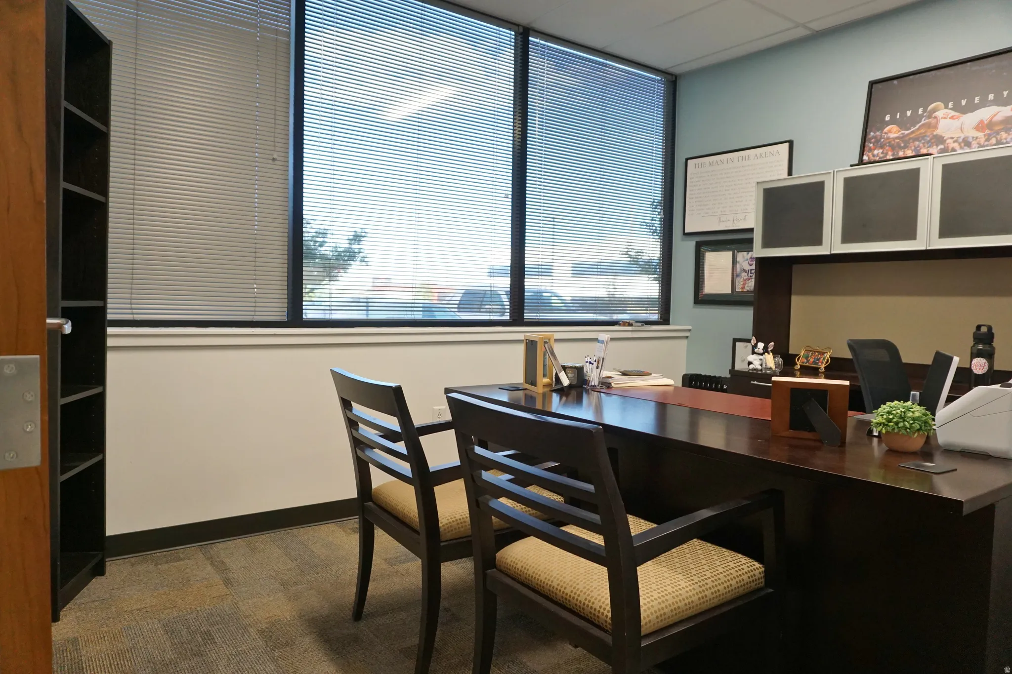 Office area featuring a paneled ceiling