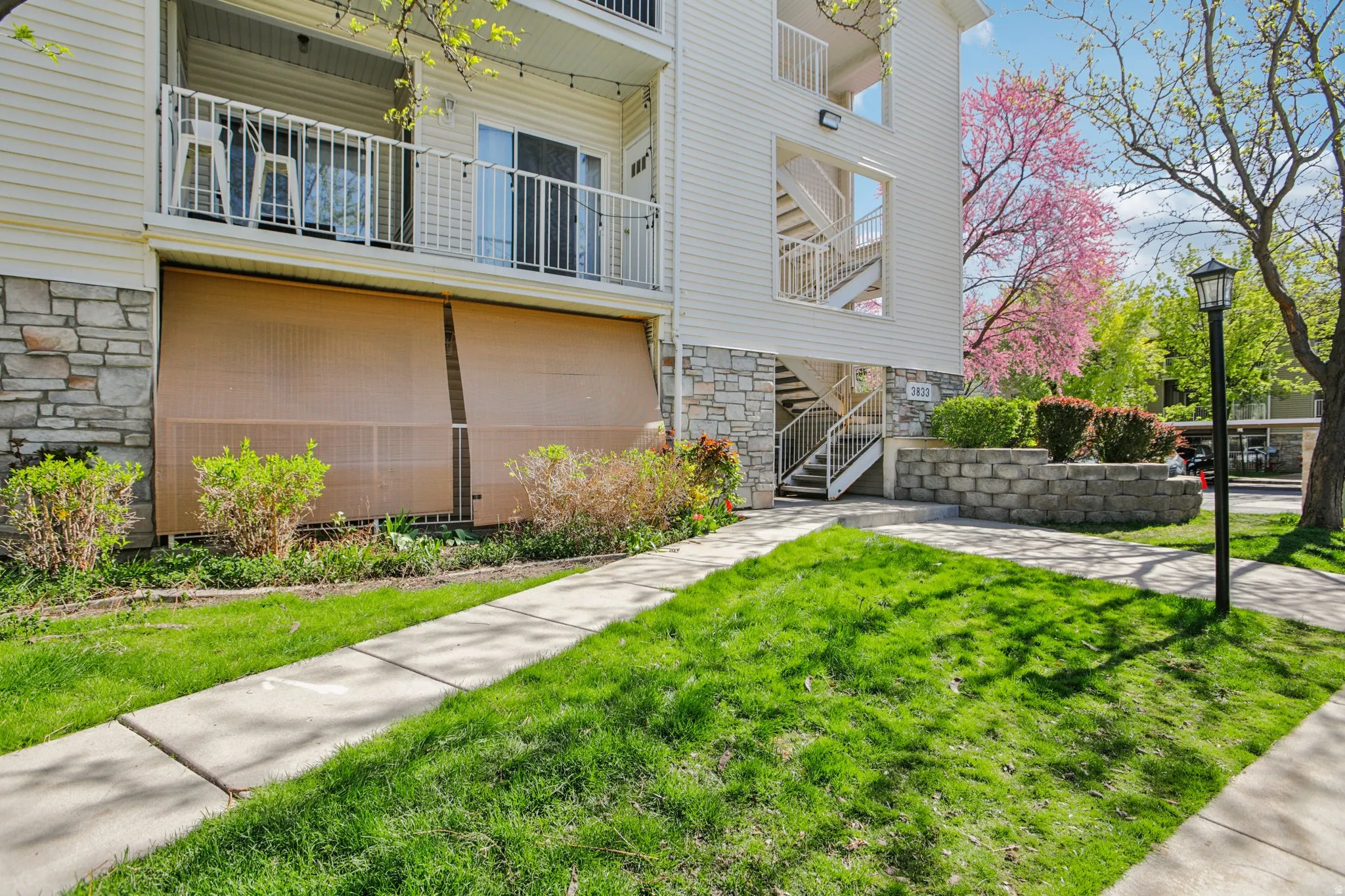 View of apartment building / complex featuring stairs