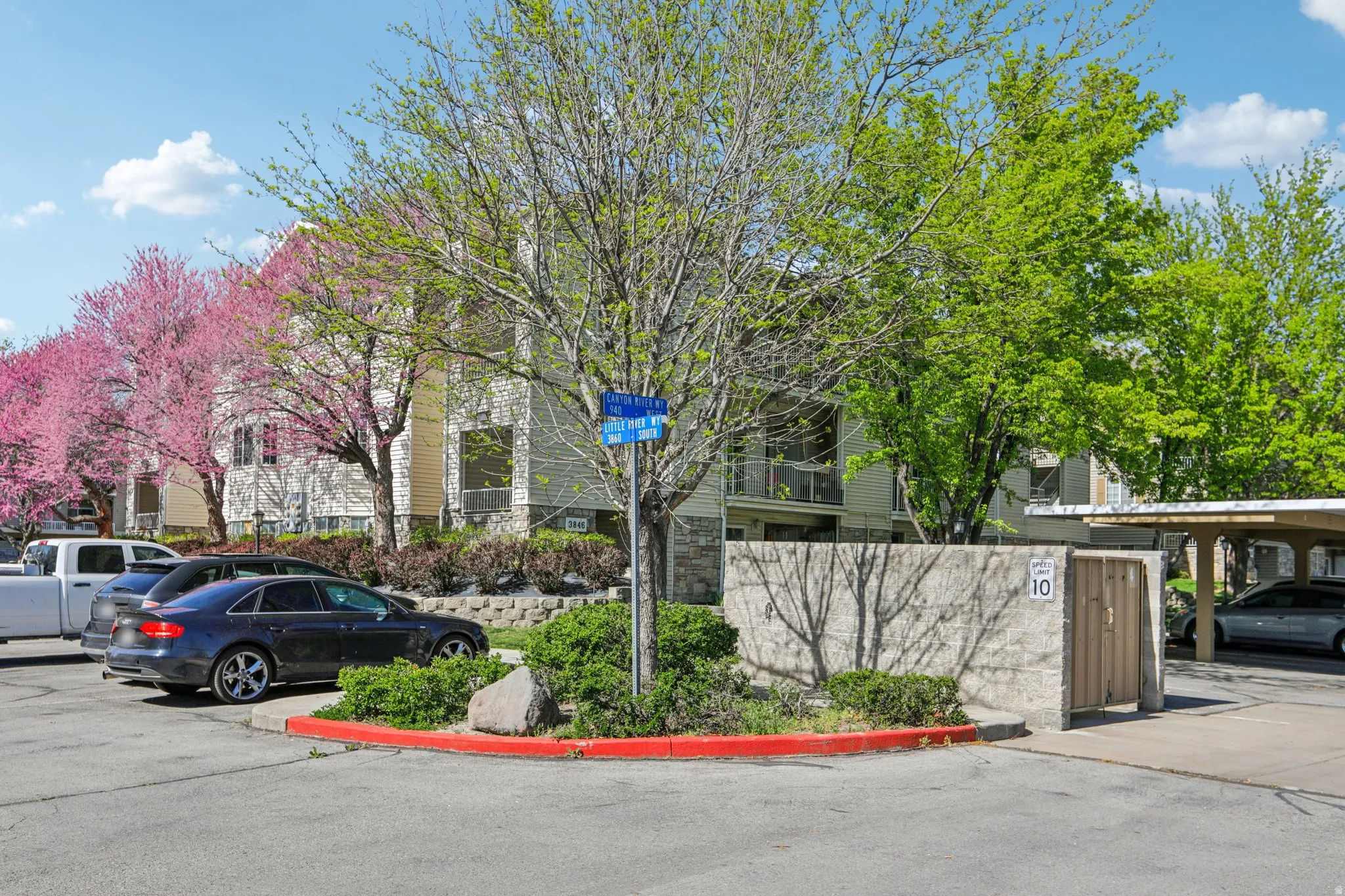 View of property with uncovered parking