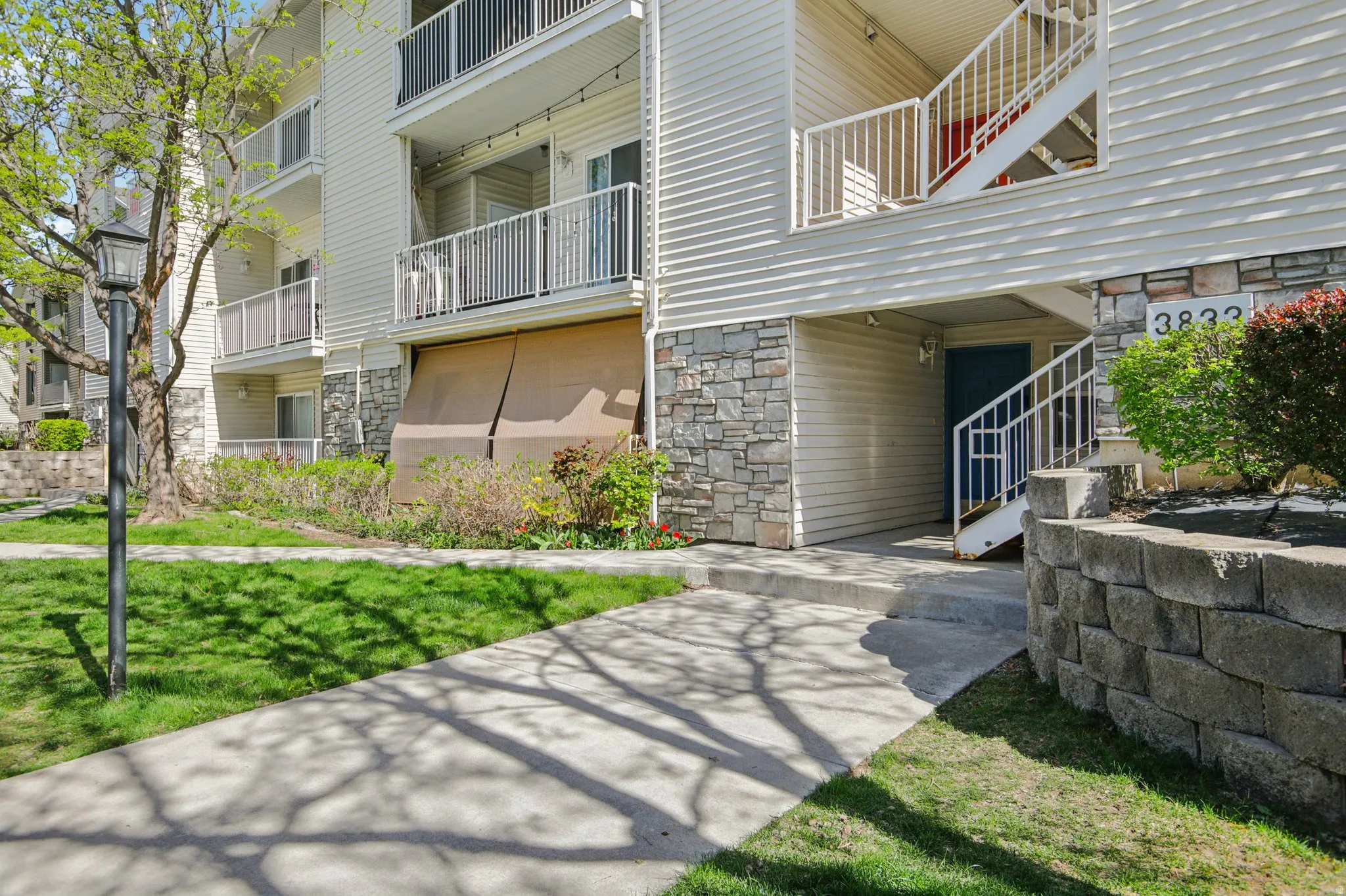 Property entrance with stone siding