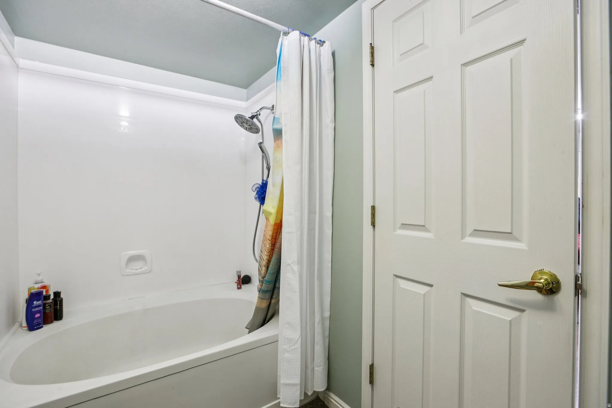 Full bath featuring shower / bath combo