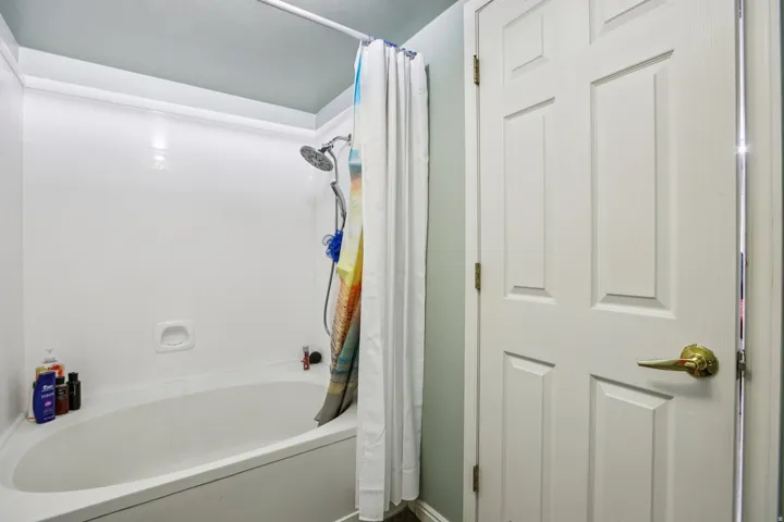 Full bath featuring shower / bath combo