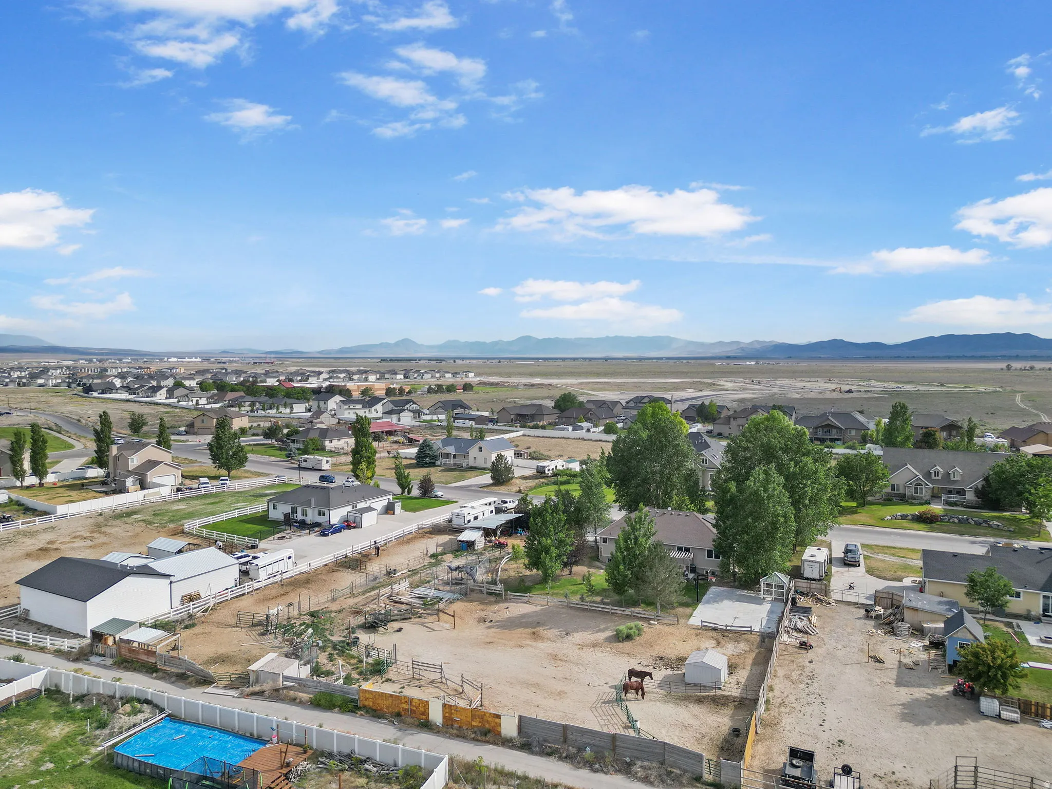 Aerial view of residential area with a mountainous background