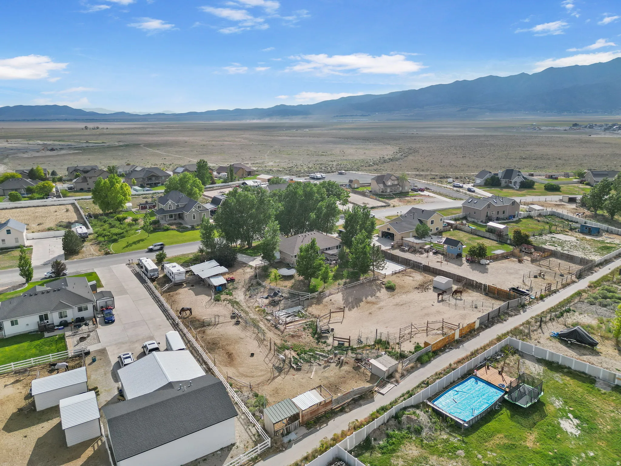 Aerial perspective of suburban area with a mountain backdrop