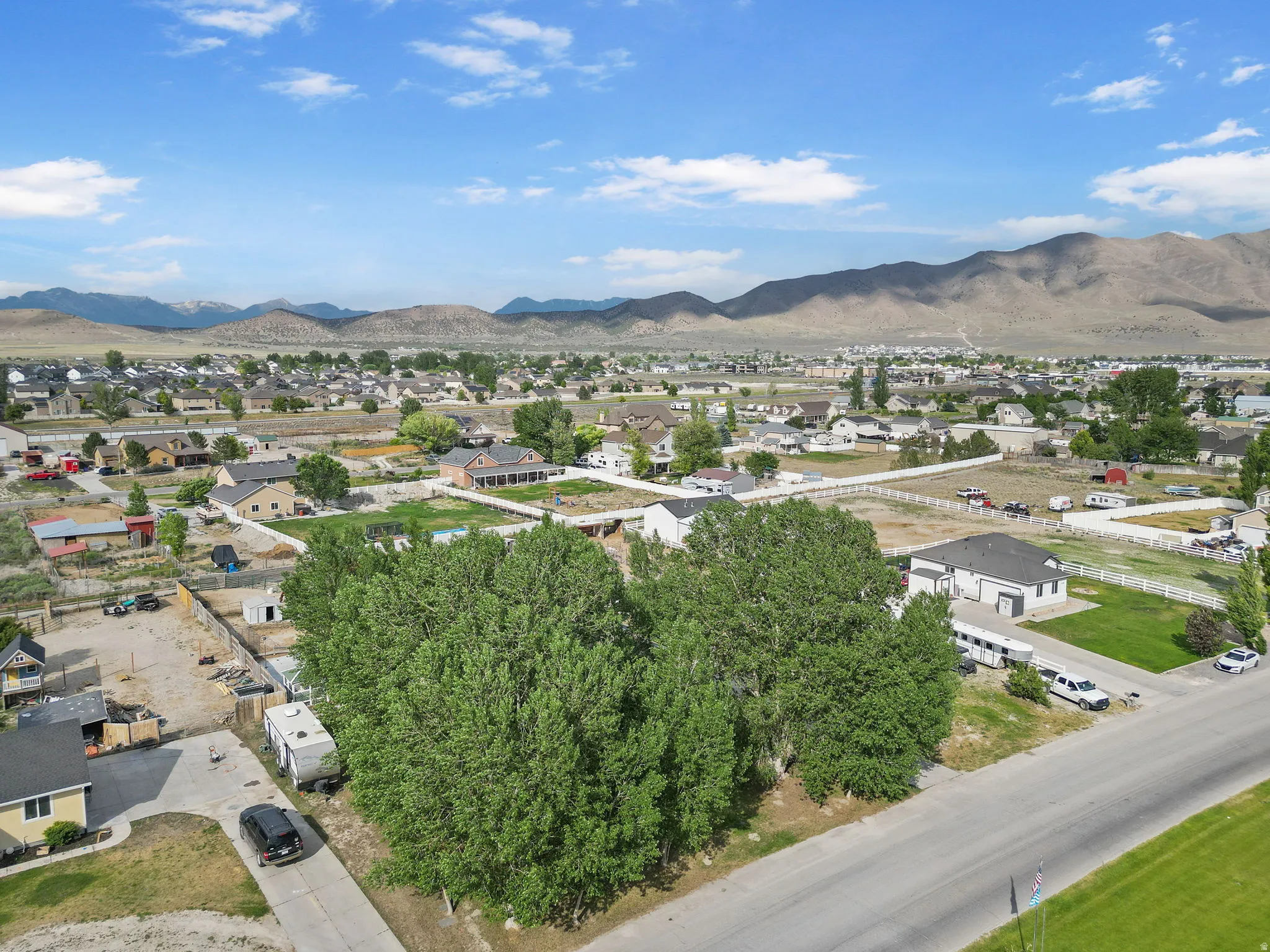 Aerial view of residential area featuring a mountainous background