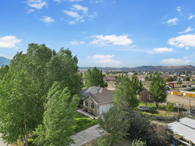 Aerial perspective of suburban area with a mountainous background