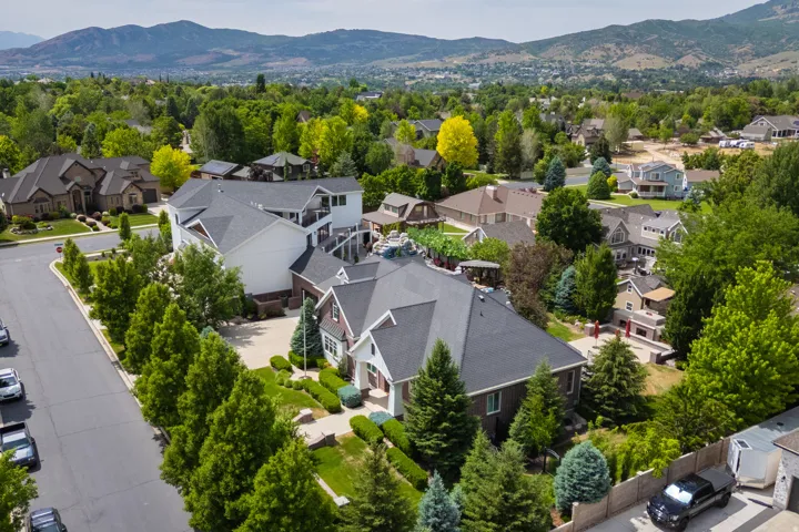 Aerial perspective of suburban area featuring a mountainous background